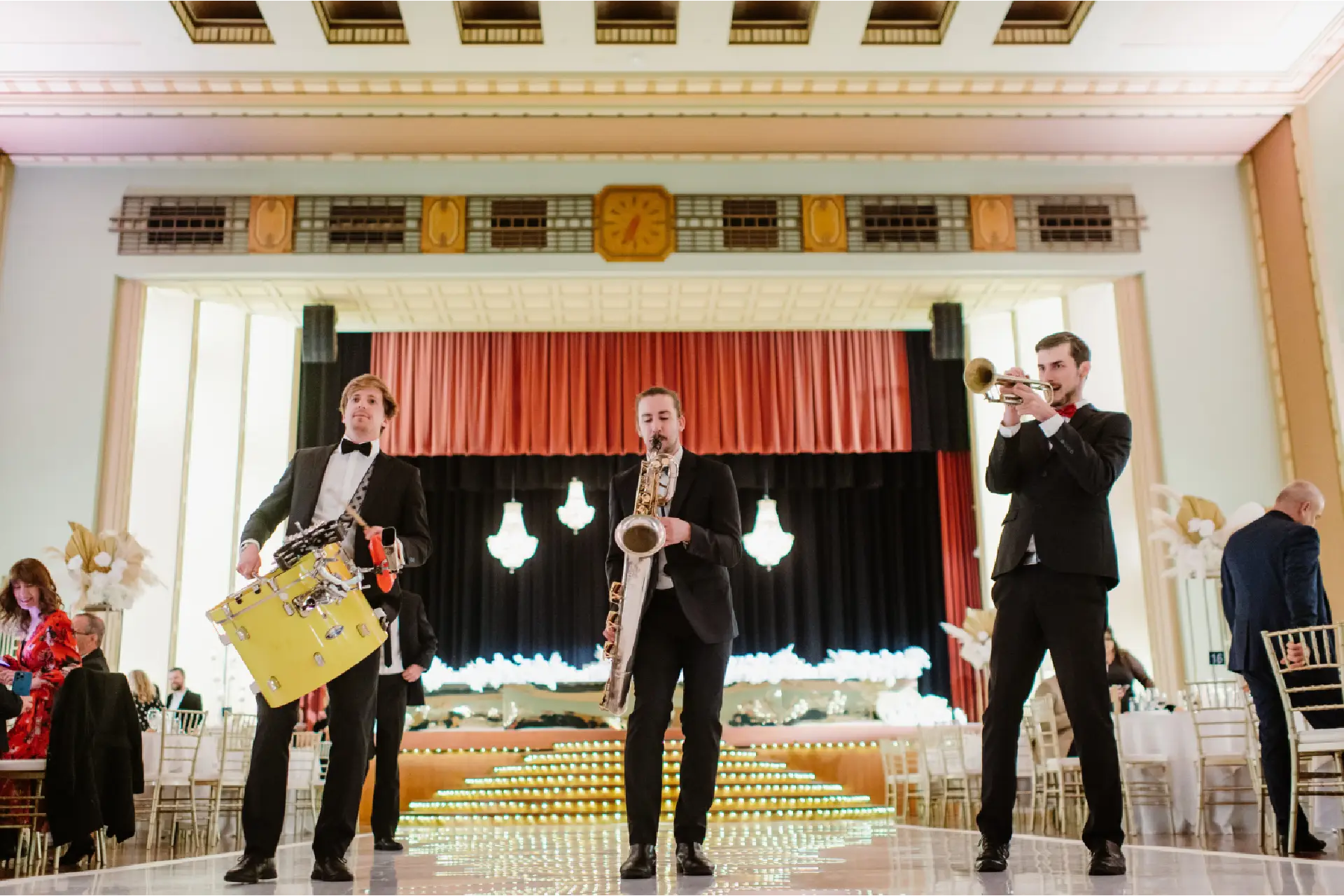 Live brass band performing on stage at an Art Deco event inside The Centre Ivanhoe.