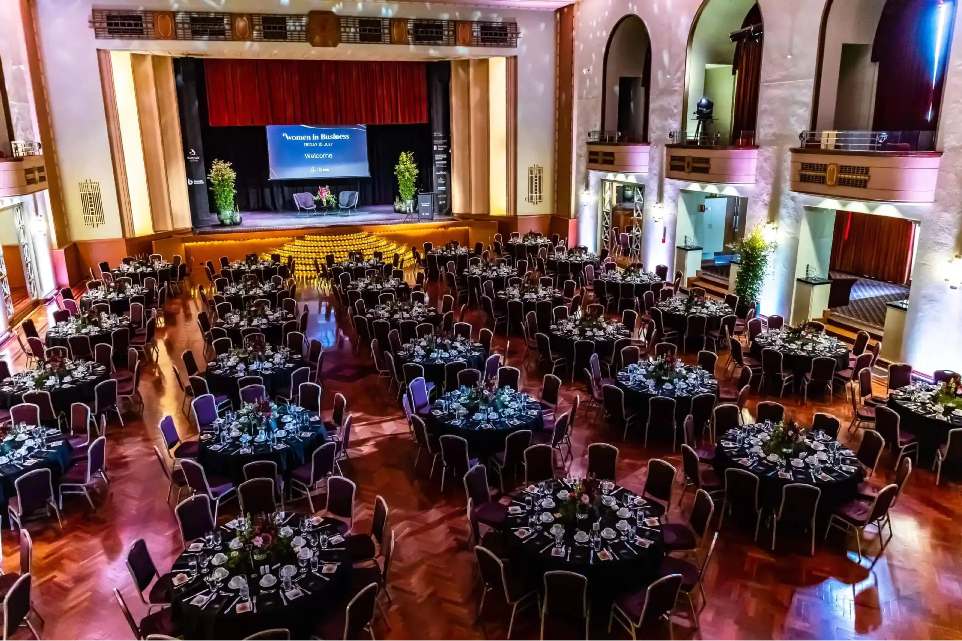 High-capacity corporate gala banquet setup with black table linens inside The Great Hall at The Centre Ivanhoe.