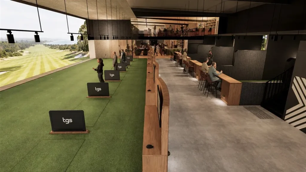 Perspective view of high-tech virtual driving range hitting bays with synthetic turf and seating counters at The Golf Sanctuary.